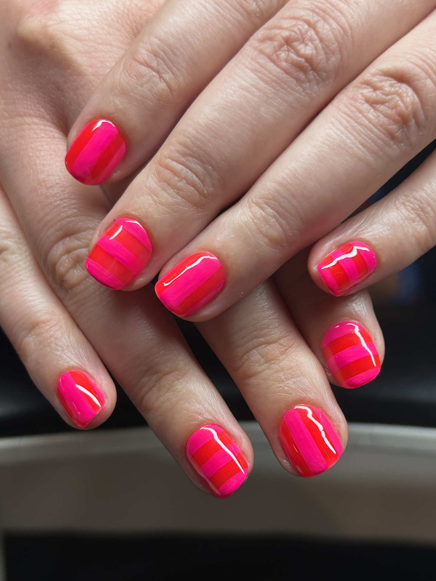 Hot pink and red striped short manicure