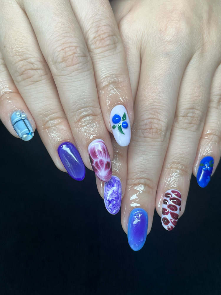 Mixed blueberry, marble, and chrome nail art on almond nails